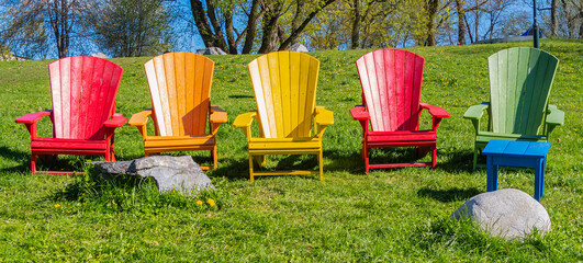 Colorful Adirondack Chairs in a Sunny Garden