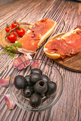 Freshly baked, crusty bread, a touch of olive oil, and slices of ham. It's simplicity at its finest.