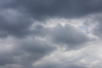 overcast sky filled with dark and light gray clouds, conveying a sense of moodiness