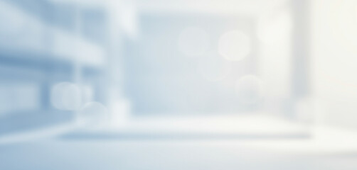 Blurred interior space with light blue and white tones creating an abstract background that showcases a minimalist yet functional design, ideal for clinical or modern healthcare settings.