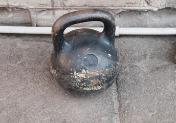 Metal kettlebell for sports on the floor