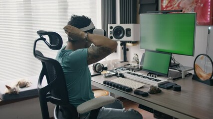Music producer explores virtual reality while seated in high-tech audio production studio - Powered by Adobe