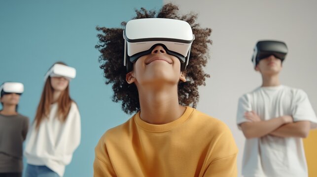 Group of diverse high school students wearing virtual reality headsets are exploring metaverse, enjoying immersive experience in the classroom