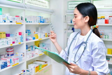 Pharmacist filling prescription in pharmacy drugstore
