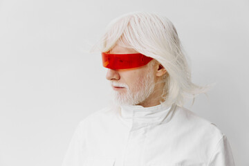 Futuristic portrait of an elderly man with long white hair and red visor glasses, wearing a sleek...