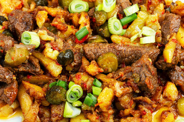 Meat stew made from beef with potatoes and pickles.