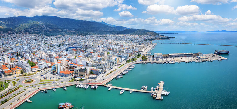 Panoramic aerial view of the skyline of Volos, Greece, with new port and marina, ferry terminal and waterfront promenade