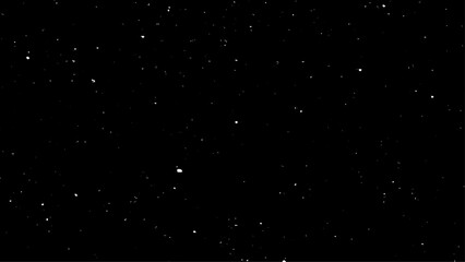 Snowstorm texture. Bokeh lights on black background, shot of flying snowflakes in the air. 