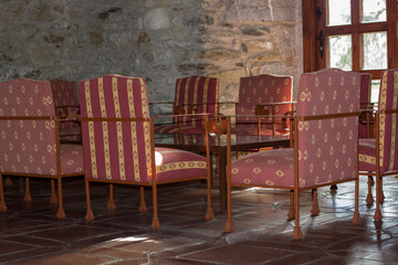 red, vintage chairs and table by the castle window