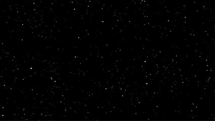 Flying dust particles on a black background