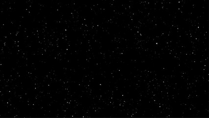 Flying dust particles on a black background