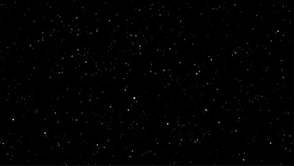 Flying dust particles on a black background