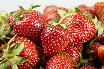 Ripe strawberries background. Sweet seasonal fruit concept.