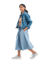 Asian female model about 20-25 years old, walking with casual stride, wearing denim jacket, blue midi skirt, and sneakers, side view. Isolated object with transparent background