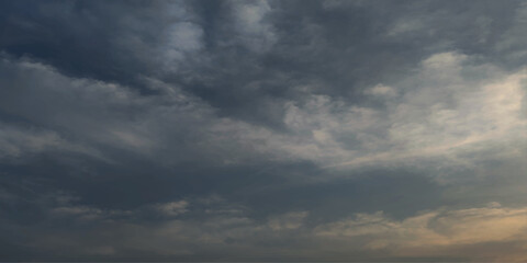 Obraz premium Dark cloudy sky in rainy season. Cloudy dramatic stormy grey sky background with clouds. cloudy sky, grey sky, bad weather, rainy day, winter day during a storm, sky background with clouds.