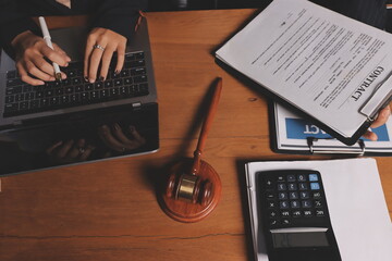 Attractive young lawyer in office Business woman and lawyers discussing contract papers with brass...