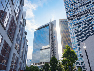 Bottom view of modern skyscrapers in business district in day light