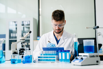 Fototapeta premium scientists conducting research investigations in a medical laboratory, a researcher in the foreground