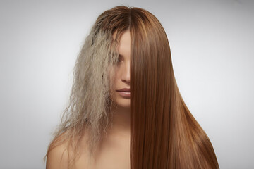 Long straight hair frames the face of a young woman, highlighting her healthy skin and glamorous beauty