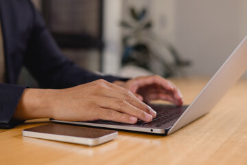 businessman working in office using laptop. professional business executive manager looking at computer thinking on digital strategy, sitting at desk