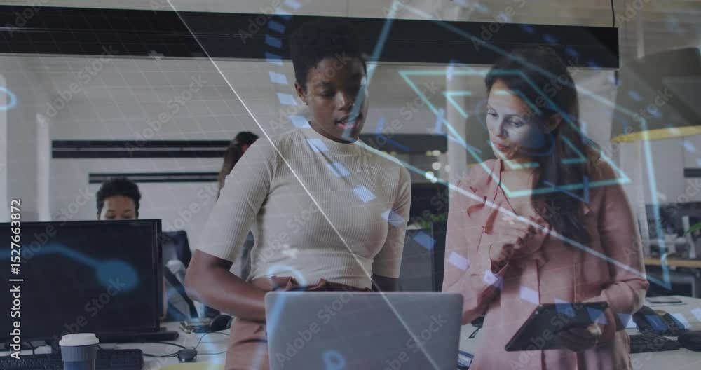 Poster colleagues opening laptop and tapping tablet visualizing tech data with floating geometric icons