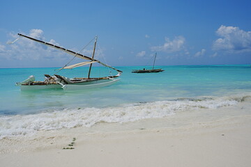 Beauty fishing boats on Jambiani beach at Indian Ocean in African Zanzibar island in Tanzania