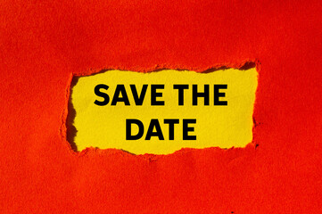 Save the date message written on ripped torn red paper on yellow background. Conceptual save the date symbol. Copy space.