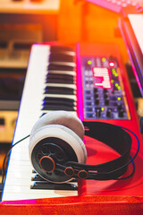 headphone on electric piano in studio, music background
