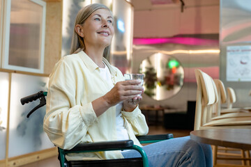 Caucasian mid aged woman on a wheelchair in a rehabilitation center