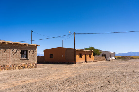 Remote desert houses under clear blue sky in La Puna