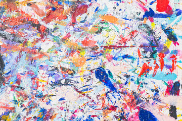 Venetian mask workshop with vibrant paint splatters