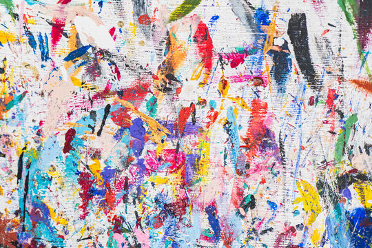 Naklejki Venetian mask workshop with vibrant paint splatters