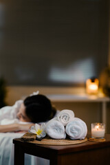 Relaxed lady at spa with focus on spa equipment. Wellness concept