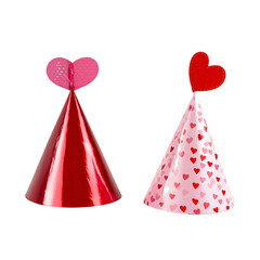 Two festive party hats with heart designs for Valentine Day celebration