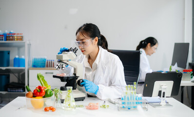 Food scientists in lab coats, testing samples, and analyzing food safety and quality