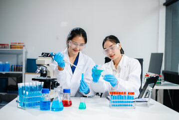 Female Scientists Conducting Chemistry Research in Modern Laboratory