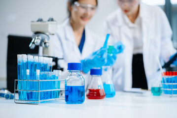 Fototapeta premium Female Scientists Conducting Chemistry Research in Modern Laboratory