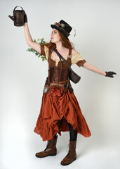 Full length walking portrait Steampunk Botanist, mad scientist, female model in Victorian Costume...