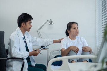 Stressed senior old patient are treated by a psychologist or psychiatrist in a psychiatric clinic...