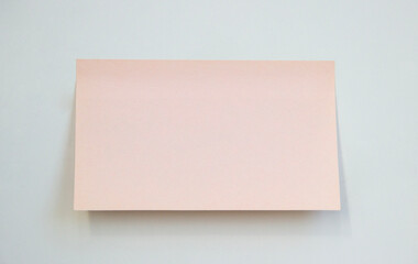 blank pink rectangular sticky note isolated on neutral background