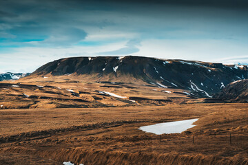 Barren rugged mountain with blue sky in remote wilderness at Iceland