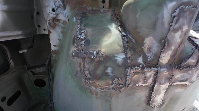 welding work in a car, car repair shop