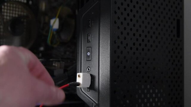 Disconnecting the audio splitter from the microphone jack of a desktop computer