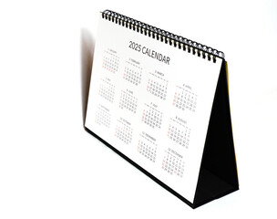 Obraz premium 2025 calendar, 2025 desk calendar on white background, 12 month desk calendar, new plan for 2025