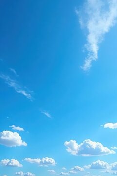 Deep azure sky, scattered cirrus clouds, bright sunlight , overhead, majestic