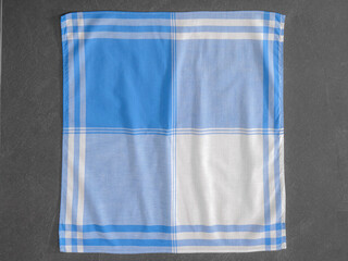Cotton handkerchief, unfolded with classic striped and checkered pattern, suitable for men.
