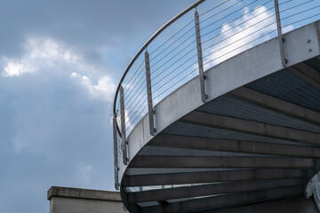helical pedestrian ramp project in external steel, modern and innovative design staircase, for contemporary architecture. stainless steel design is designed for a pedestrian overpass in a public area.