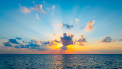 Sunset sky clouds with sunbeam scene as  Sunset horizon over the ocean landscape for background