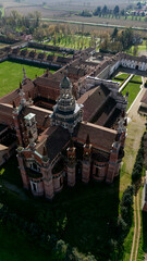 Aerial view of the Certosa di Pavia, built in the late fourteenth century, courts and the cloister of the monastery and shrine in the province of Pavia, Lombardia, Italy