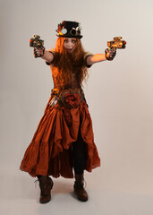 Full length walking portrait Steampunk Botanist, mad scientist, female model in Victorian Costume...
